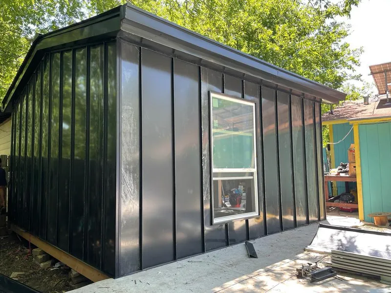 Black standing seam metal wall panels for Roof Inspection in Posen